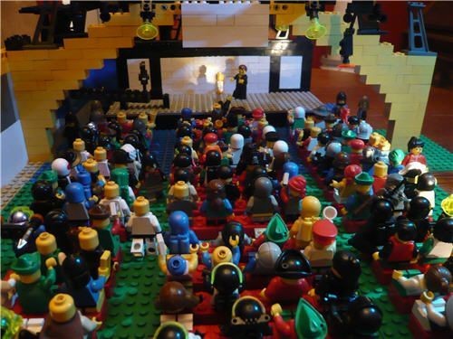 micro conference market: Photograph of a Lego model of a conference hall full of attendees listening to speakers on a stage. Photo attribution: Mini Dreamforce 2010