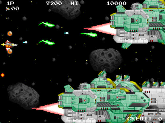 Player shooting green squiggly shots at two huge battleships in space in INFINOS EXTRA STAGE