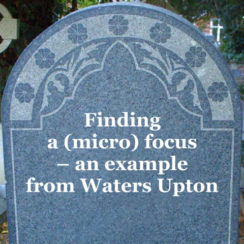 Image: A gravestone (at Waters Upton) with the words "Find a (micro) focus - an example from Waters Upton" added to it.