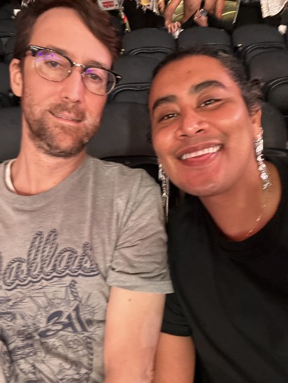 My husband James and i at the Beyoncé concert. We are smiling into the camera