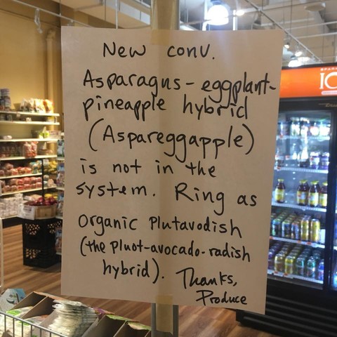 a hand-written sign explaining how to ring up non-existent produce, like "asparaggapple."