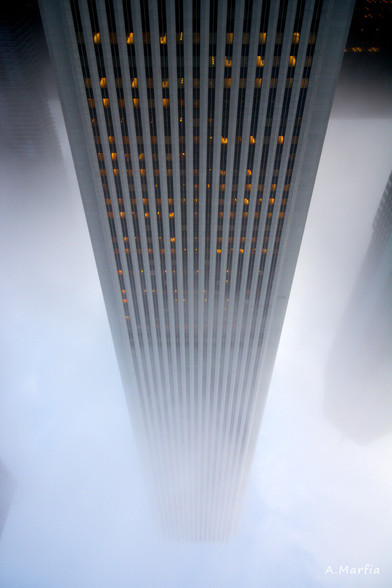 A color photograph in Chicago on a foggy day. Pictured is the Aon Center skyscraper, flipped upside down in post processing. Circa 2014.