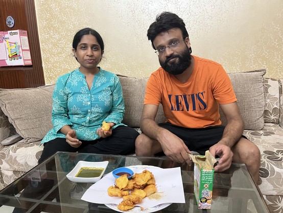 Ruchika and her brother getting ready to chow down on some very tasty pakoda.