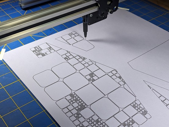 A 2-axis pen plotter drawing a piece made up of squares subdivided into smaller squares.