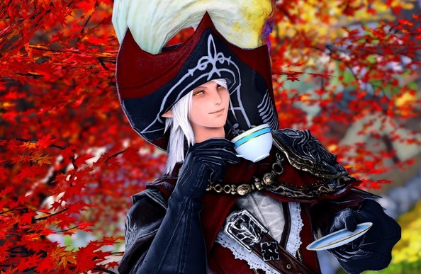 Amon (using his old hairstyle) smiling and drinking tea with fall colors in the background.