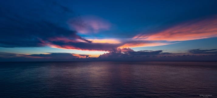 A dramatic and colorful sunset over the sea.