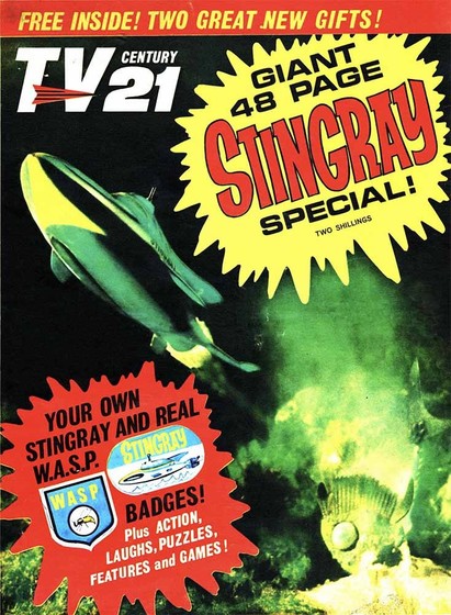 TV21 comic spotlighting the children's TV Show Stingray. On the cover: top = "free inside, two great new gifts; first exclamation balloon = "Giant 48 Page Stingray Special, two shillings"; second exclamation balloon = "Your own Stingray and real W.A.S.P. badgets, plus action, laughs, puzzles, features and games!'; main cover picture the Stingray craft and being chased by a baddie vehicle in the shape of an aggressive fish.