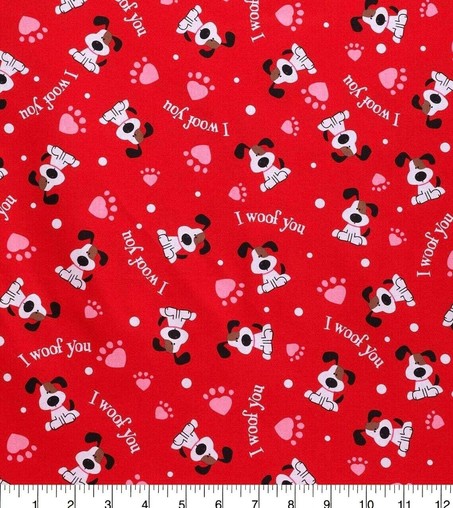 Dog-themed fabric with sprinkled images of an adorable white and brown mutt, pink heart shaped paws, and the words I woof you on a red background