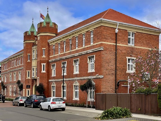 Selwyn College was/is a private hall of residence for university students; large 3-story facade of red brick