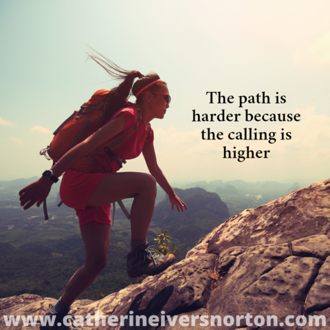 A woman with a long ponytail appears determined to scale the height of a mountain. Caption read, "The path is harder because the calling is harder."