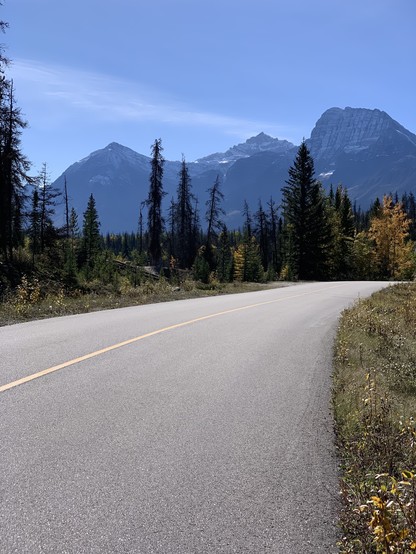 One of my favorite lunch spots along the now closed section of highway 93A. Late September means colour on trees and no vehicles on the road: Jasper National Park.
