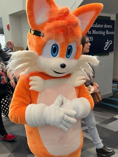 Someone wearing a full-blown mascot suit of Tails from Sonic the Hedgehog.