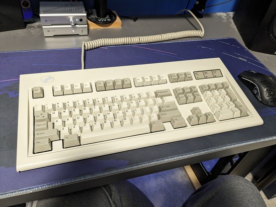 A picture of my IBM Model M in a similar spot on my desk.