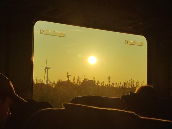 Wind turbines through train window, north Germany