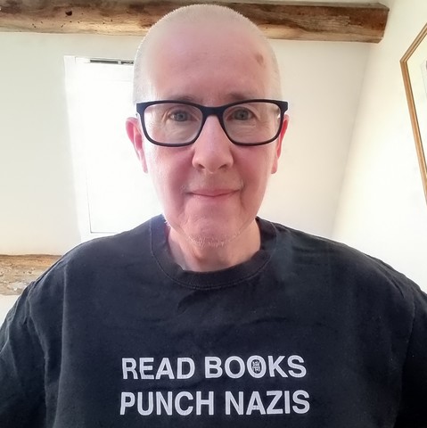 Selfie with tee shirt. The legend says Read Books Punch Nazis
