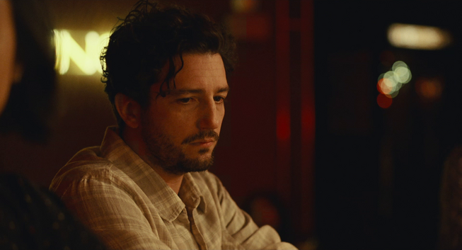 Arthur (John Magaro) appears to be lost in melachonic thought.