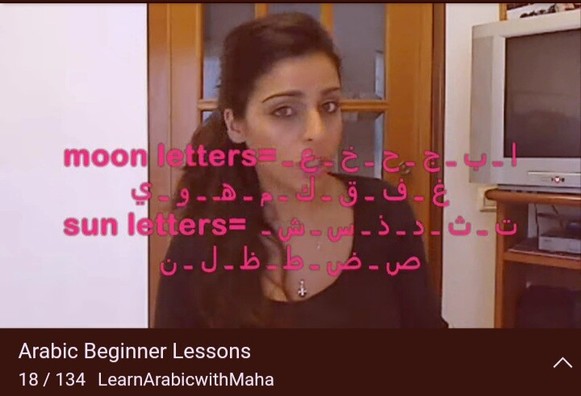A screenshot of a YouTube video from the playlist Arabic Beginner Leasons, on the channel Learn Arabic with Maha. The screenshot shows the teacher with a list of Arabic moon letters and sun letters superimposed across the screen.
