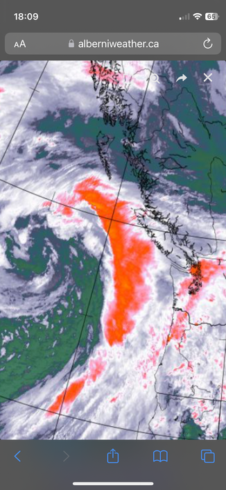 A large band of strong precipitation coured in orange curls toward Vancouver. Satellite picture from 5:50PM Pacific time.