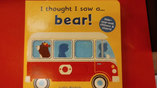 Small children's board book, I Thought I Saw a Bear, which has a sliding element, slide it and different bears appear in a bus.