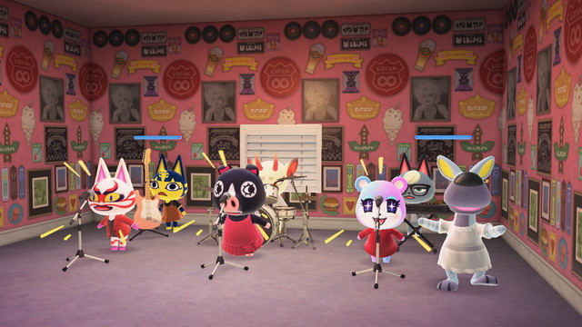 Animal Crossing: New Horizons screenshot. Set in a pink diner area with various islanders dressed as The B52s from their Love Shack music video. The front row has Kabuki, Agnes, and Judy singing into microphones wearing read. In the back row is Ankha, Shino, and Raymond playing instruments (guitar, drums, and keyboard respectively). Over to the right is Walt (grey kangaroo) dressed in a white dress dancing with a flower in his hair.