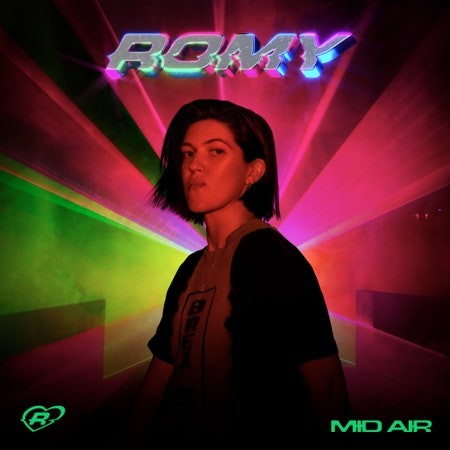 Romy's Mid Air album cover, a photo of the artist with a multicoloured background