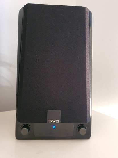 Front of right-hand SVS speaker with Bluetooth icon illuminated.