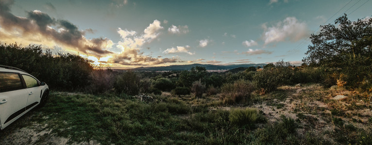 Panoramaphoto with view to south from in hill. A village to the feed an in the background the Pyrenees in the morning light.