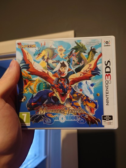 Physical copy of Monster Hunter Stories on Nintendo 3DS 

Front cover shows various monsters from the series as the main character rides a Rathalos