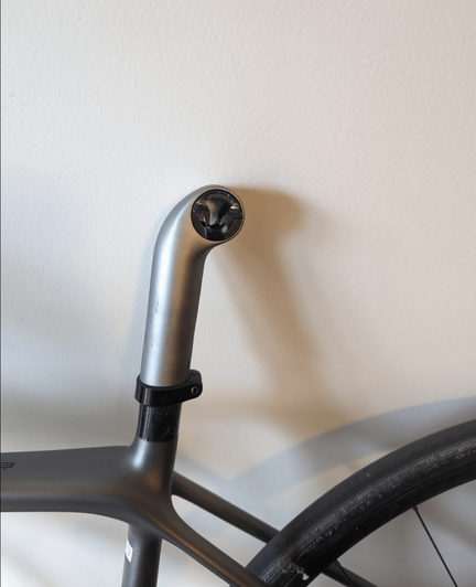 The saddle tilt/angle is now pointing up after going on a speedbumb too fast. I'm not sure what I need to do to set it properly again ? The black plastic thing inside the post doesn't seem to move or have any bolt. When tightened, the saddle angle follow the edge of the plastic thing. Thanks!