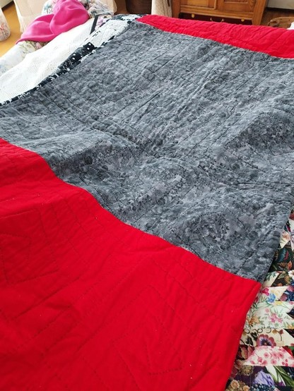 reverse side of quilt, 2 large red blocks with grey block in middle