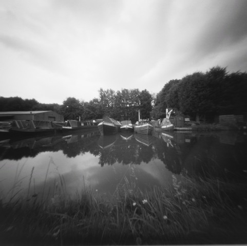 black and white photo of boats moared on the Stone canal and  shot with pinhole camera