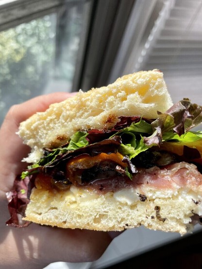 Mozzarella, prosciutto, roasted portobellos, roasted red and orange peppers, organic greens, home made balsamic reduction.