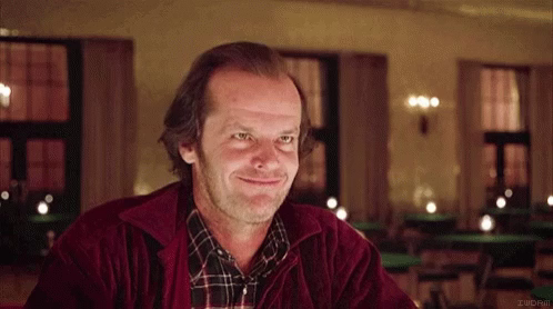 Jack Nicholson nods grimly in the Gold Room, in The Shining