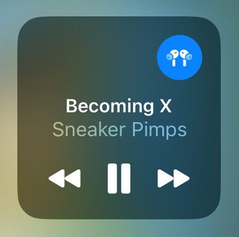 A screenshot of the Audio section of Control Centre on iOS 17, with a blue indicator in the top right corner to show that headphones are currently connected as the audio output device.

Below it are the details of the audio thatРђЎs currently playing (the song Becoming X by Sneaker Pimps) and at the bottom are previous, pause and next playback controls.
