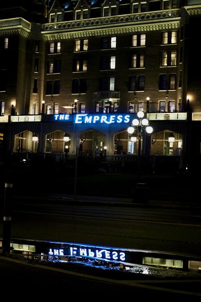 A badly cropped shot of the front of the Empress Hotel, also reflected in a puddle of