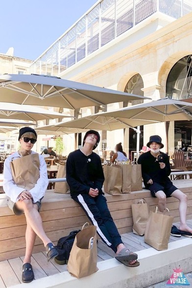 Jimin, JK and Yoongi chilling after what was apparently a successful shopping experience.