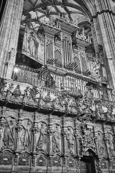 photo of the Salamanca Cathedral organ. Below it is ornately carved woodwork of the choir, and abover are the towering arches and vaults. And there is religious artwork, of course.