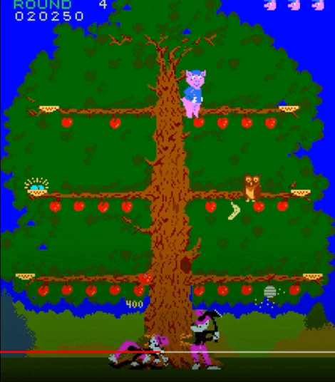 Gameplay gif from "Pig Newton". A pig wearing a blue shirt and hat climbs up a tree and drops apples, bombs, and horseshoes on wolves patrolling below the tree. The wolves have axes, and are attempting to cut the tree down, and, unfortunately in this case, succeed in doing so. The tree collapses, and the wolves capture the pig in a net and carry him off.