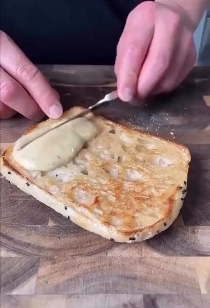 short clip of hands making a turkey bacon cheese lettuce sandwich