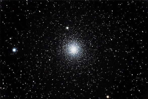 A globular cluster of thousands of stars densely packed.