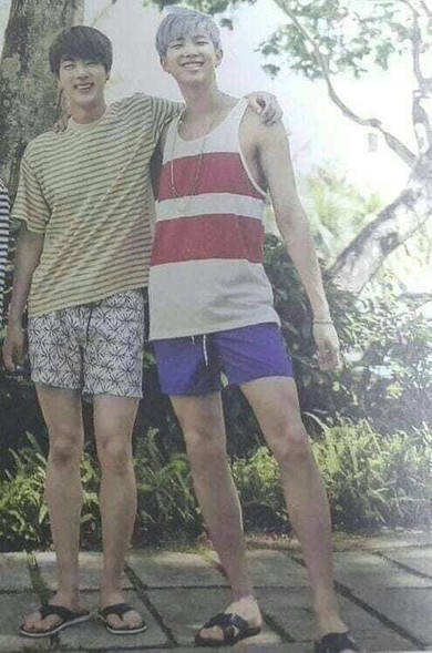 tanktops, shorts, flip flops, arms around each others shoulders, very youthful summer vibes