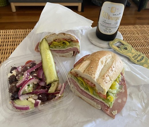Italian Sub w/ Salami, Mortadella, Provolone, Pepperoncini, Lettuce, Tomato, and oil+vin. Paired with a greek salad, a pickle, and my current go to beer