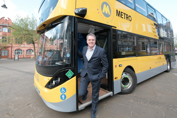 Mayor Steve Rotheram stepping off a new hydrogen bus.