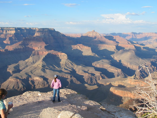 woman looking out on the vast plateaus and canyons of #GrandCanyon National Park