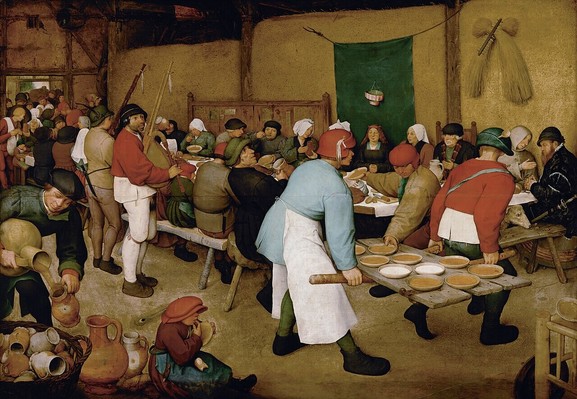 painting by Bruegel showing a lively wedding feast in a barn, two men in the foreground bring in bowls of food using a door as a big tray, pipers play for the guests who are seated at a long table (more details are described in the linked-to article)