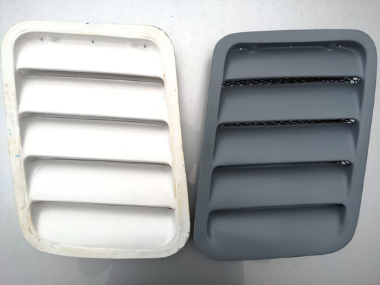 My finished RS500 vent, on the right, next to one (from the same pair) which I have done no work on. The original one has several surface imperfections, and lacks any mesh!