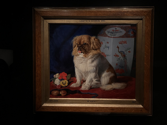 An oil portrait in a frame of a cute Pekingese dog in front of a Chinese style jar