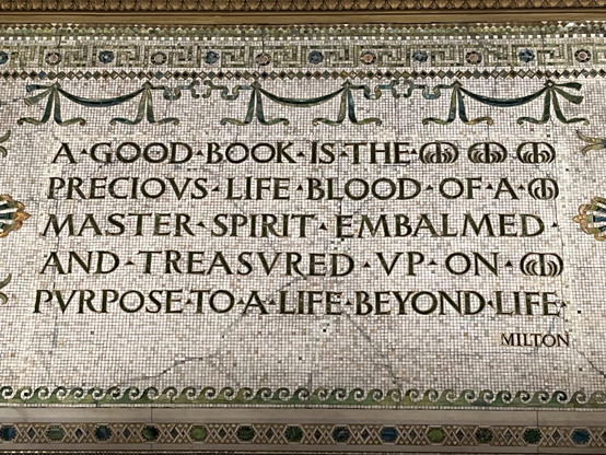 A mosaic tile quote at the Chicago Cultural Center. The quote by John Milton reads "A good book is the precious life blood of a master spirit embalmed and treasured up on purpose to a life beyond."