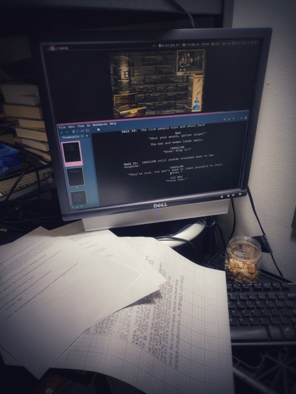 A 3:4 monitor running i3wm, with a Let's Play from youtuber Kikoskia on the top frame and the script from Our Lady Maven on the bottom. Two pages of scripts for The Garden and the hand-lettered "reader discretion" page from Barren are visible beneath the monitor.