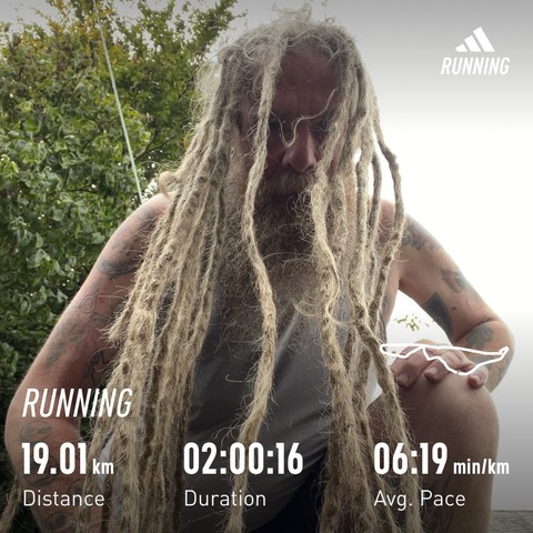 Selfie with dreadlocks falling over my face and body. Photo has run stats at bottom 19.01 km distance 2hrs 16 seconds time and 6:19 minutes per km average pace